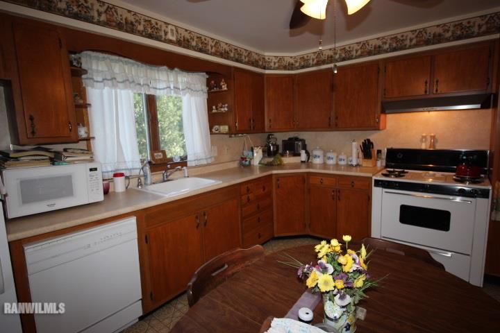 7559 West Dublin Road Freeport, IL 61032 - Photo 8 of 22 a kitchen with a sink appliances and cabinets