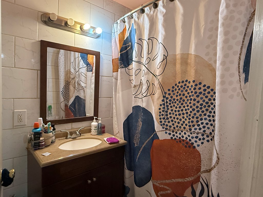 3938 Linden Circle Columbus, GA 31907 - Photo 6 of 8 a bathroom with a sink mirror and a toilet
