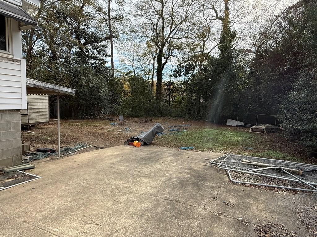 3938 Linden Circle Columbus, GA 31907 - Photo 8 of 8 a view of a basketball area with large trees