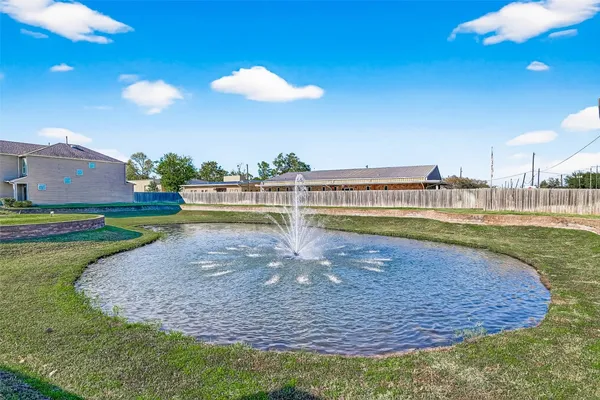 a view of a swimming pool with a yard