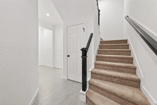 a view of staircase with white walls and white walls