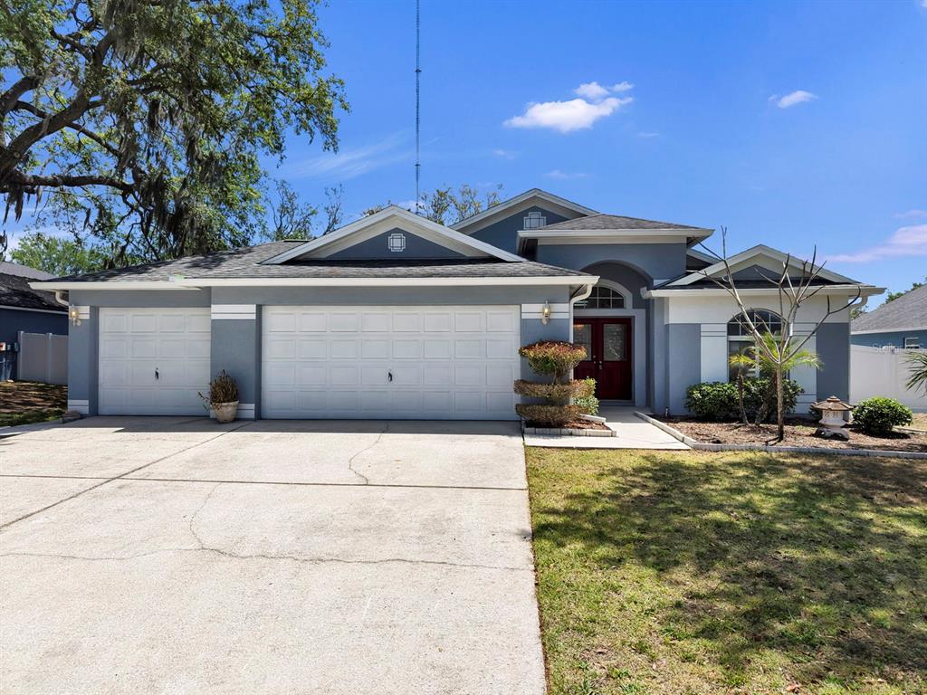 10725 Deepbrook Drive Riverview, FL 33569 - Photo 1 of 67 a front view of a house with a yard