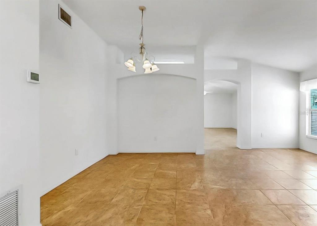 10725 Deepbrook Drive Riverview, FL 33569 - Photo 12 of 67 a view of empty room with wooden floor