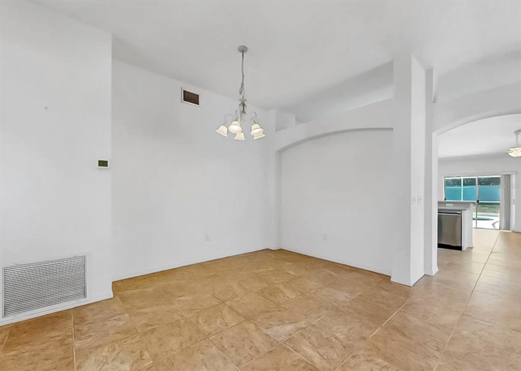 10725 Deepbrook Drive Riverview, FL 33569 - Photo 14 of 67 a view of an empty room with chandelier