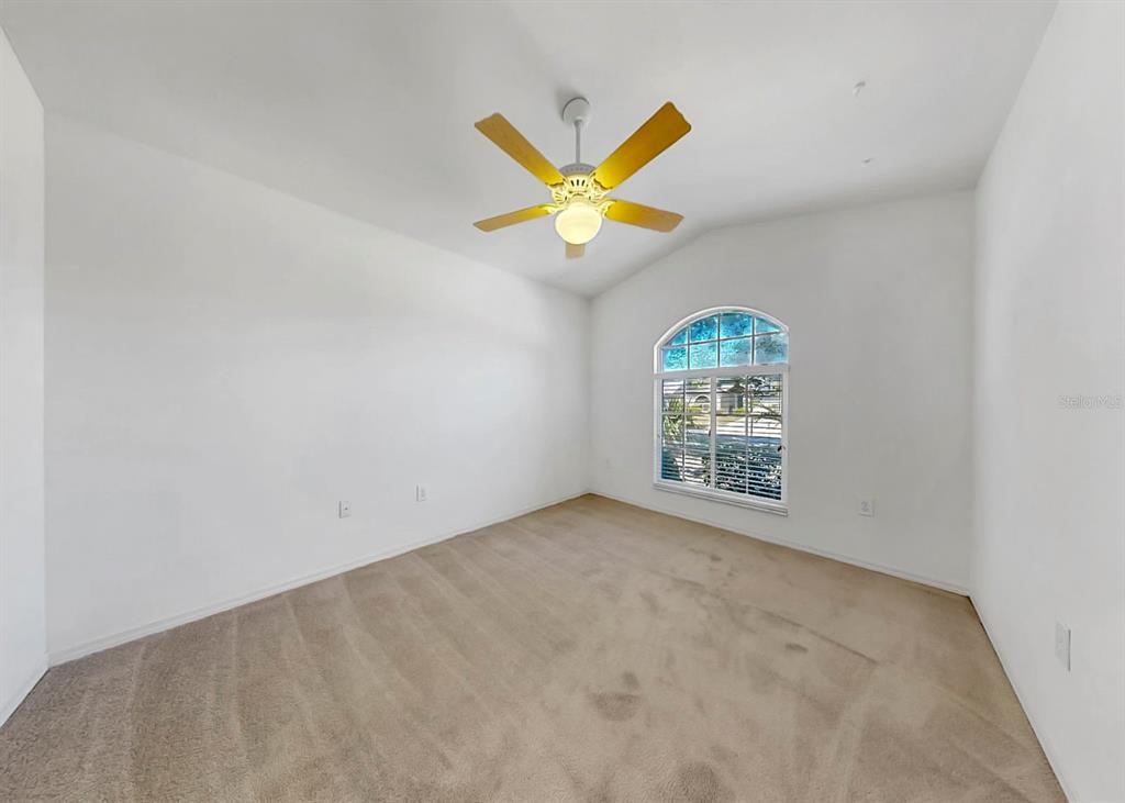 10725 Deepbrook Drive Riverview, FL 33569 - Photo 16 of 67 a view of an empty room with window and ceiling fan