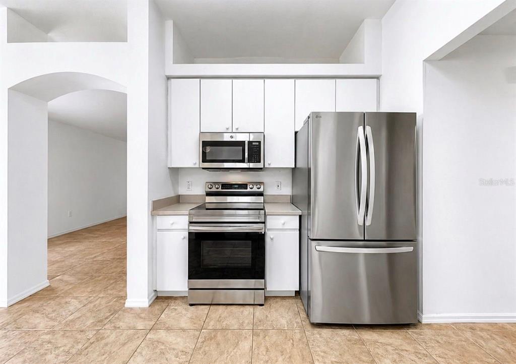 10725 Deepbrook Drive Riverview, FL 33569 - Photo 22 of 67 a kitchen with a refrigerator sink and microwave