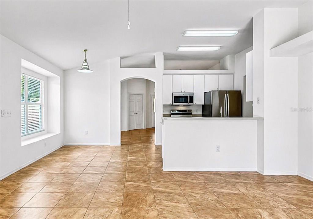10725 Deepbrook Drive Riverview, FL 33569 - Photo 26 of 67 a view of a kitchen with microwave and cabinets