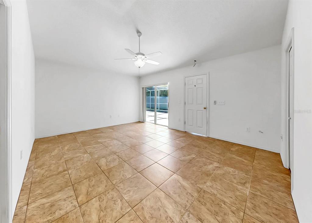10725 Deepbrook Drive Riverview, FL 33569 - Photo 32 of 67 a view of an empty room with a chandelier