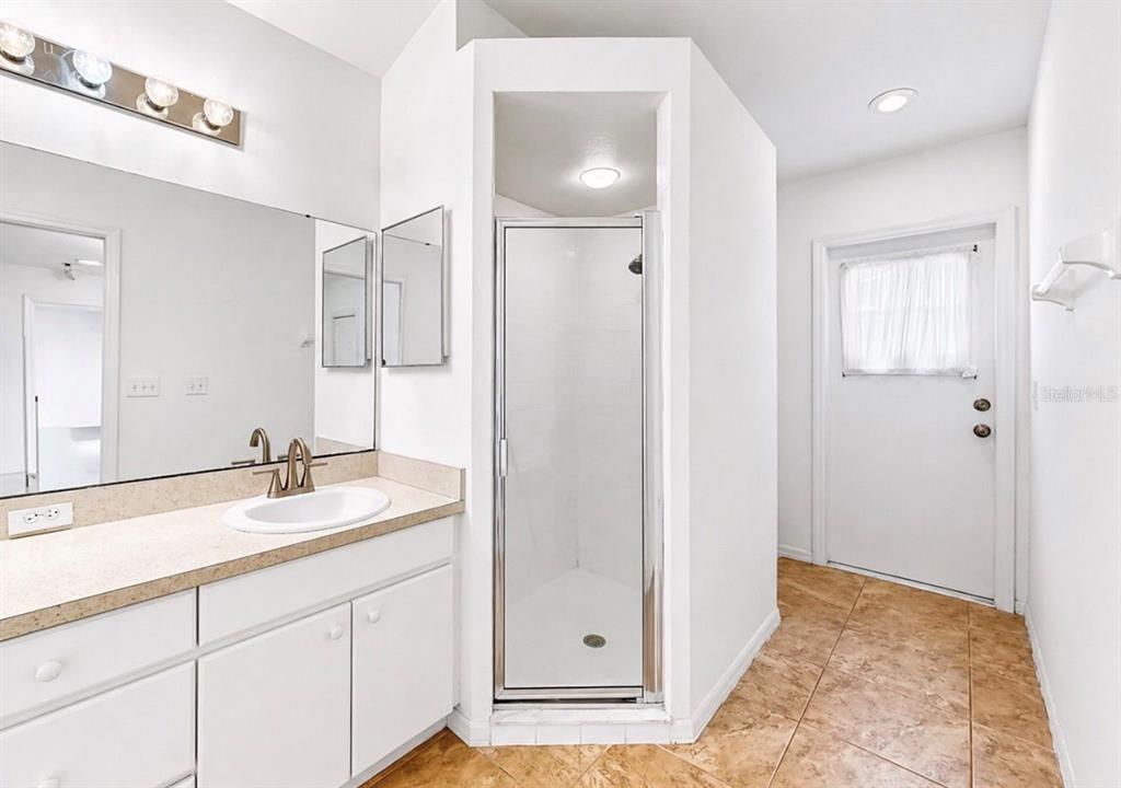 10725 Deepbrook Drive Riverview, FL 33569 - Photo 34 of 67 a bathroom with a granite countertop sink and a mirror