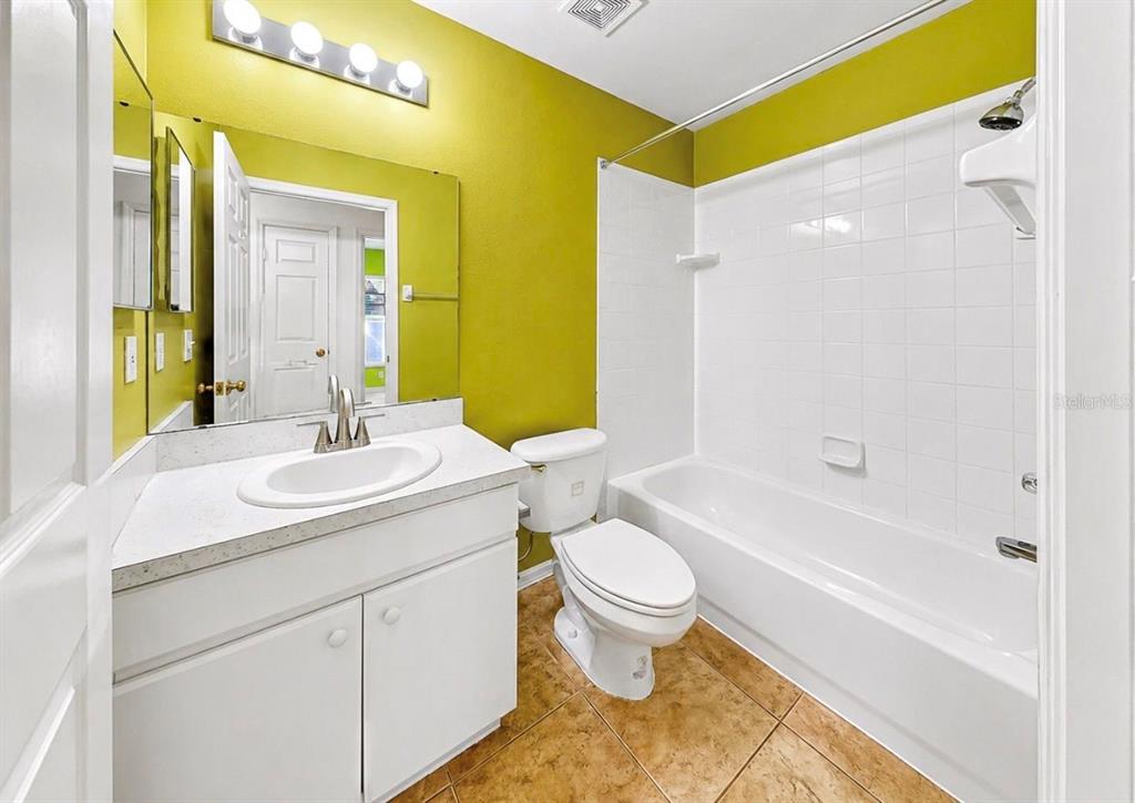 10725 Deepbrook Drive Riverview, FL 33569 - Photo 38 of 67 a bathroom with a sink and a mirror