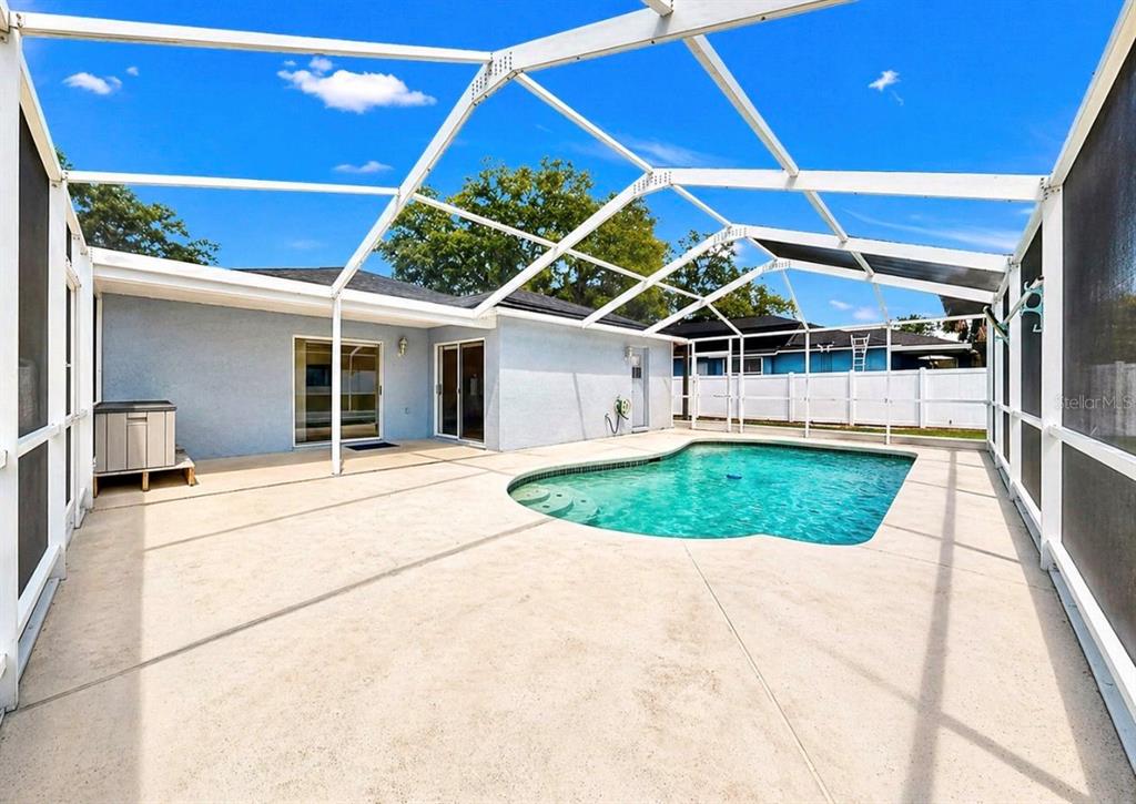 10725 Deepbrook Drive Riverview, FL 33569 - Photo 45 of 67 a view of a backyard with a patio and plants