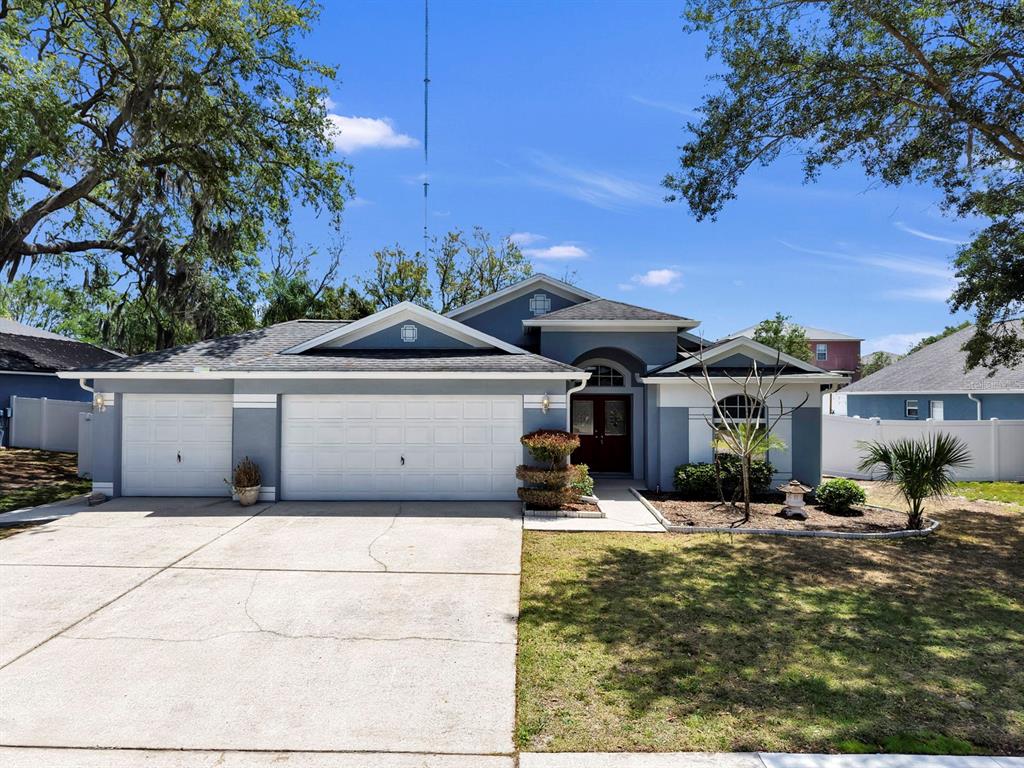 10725 Deepbrook Drive Riverview, FL 33569 - Photo 5 of 67 a front view of a house with a yard