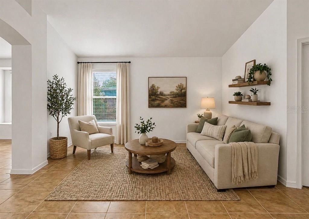 10725 Deepbrook Drive Riverview, FL 33569 - Photo 52 of 67 a living room with furniture and a large window