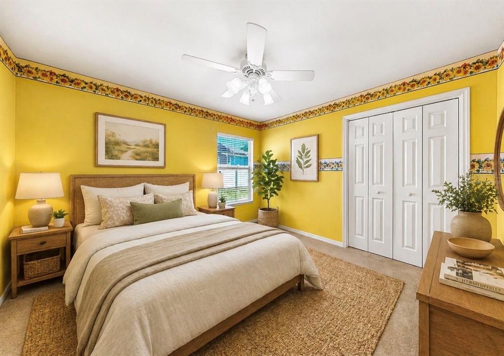 10725 Deepbrook Drive Riverview, FL 33569 - Photo 55 of 67 a spacious bedroom with a bed and a chandelier