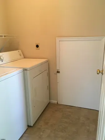 a bathroom with a toilet and a window