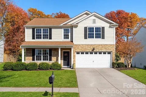 a bed room with a bed and a lamp