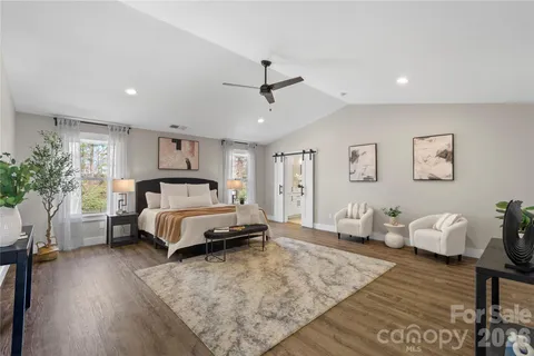 a bathroom with a tub a sink and a shower