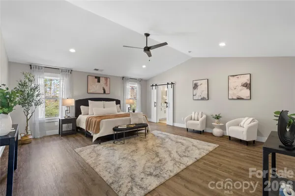 a bathroom with a tub a sink and a shower