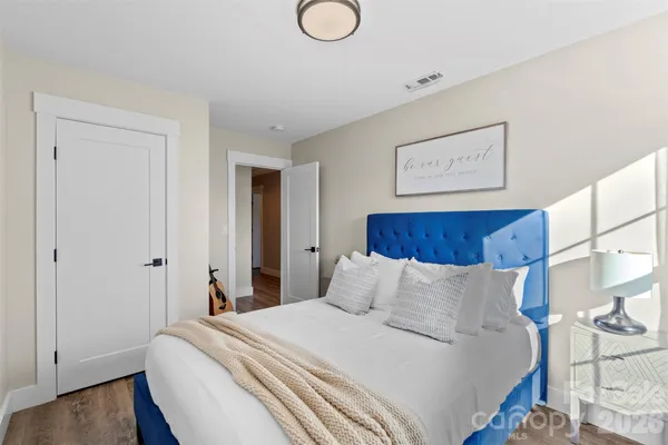 a backyard of a house with basket ball court and outdoor seating