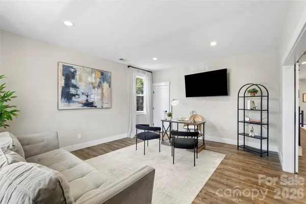 a kitchen with refrigerator and cabinets