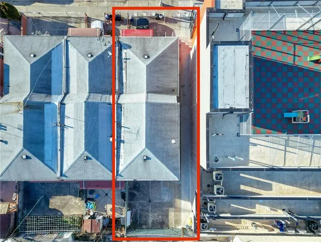 an aerial view of houses with city street