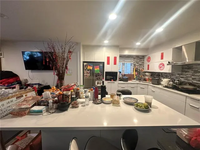a kitchen with a table and chairs in it