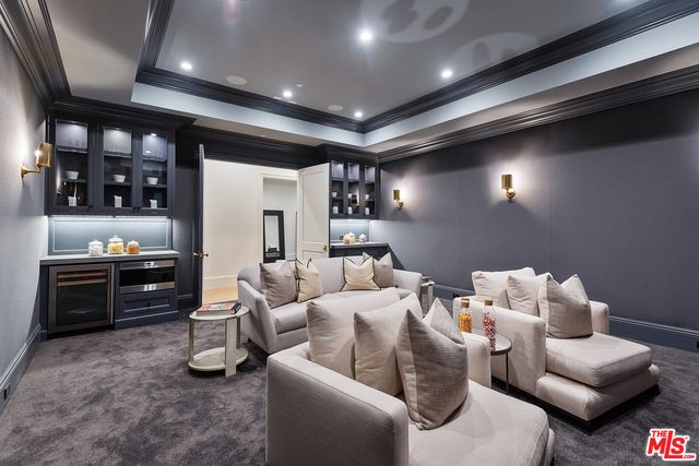 a spacious bedroom with two beds and a window