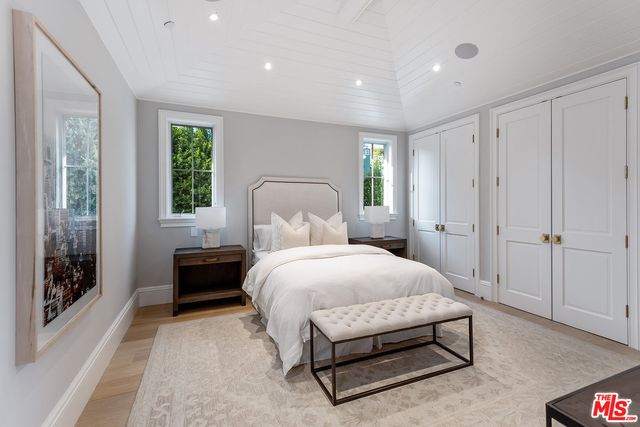 a bathroom with a sink a toilet a tub and shower