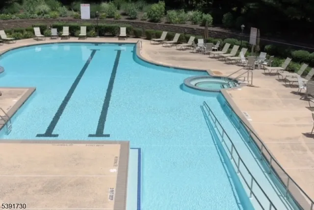 a view of swimming pool from a balcony