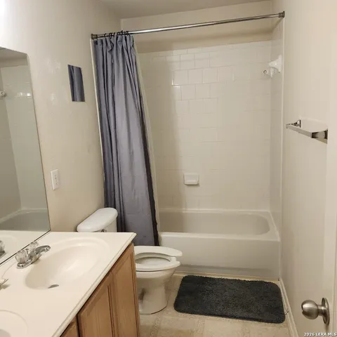 a balcony with chairs and washer