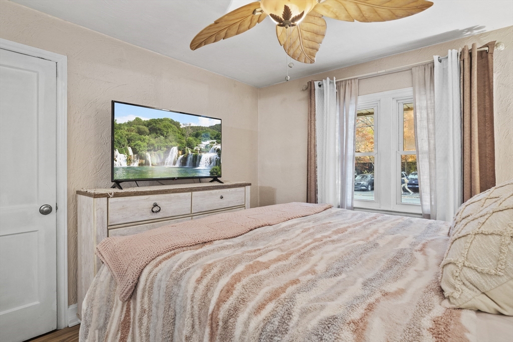 170 Stafford Street Worcester, MA 01603 - Photo 16 of 29 a bedroom with a bed and a flat screen tv