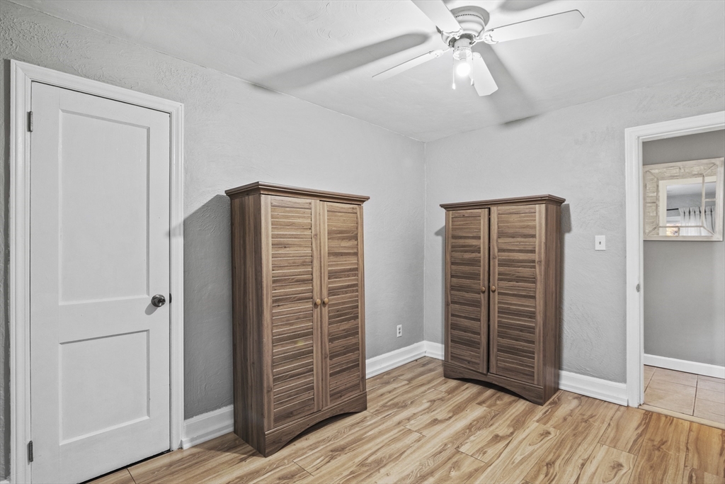 170 Stafford Street Worcester, MA 01603 - Photo 22 of 29 an empty room with wooden floor closet and windows