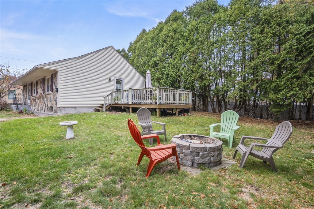 170 Stafford Street Worcester, MA 01603 - Photo 28 of 29 a backyard of a house with table and chairs