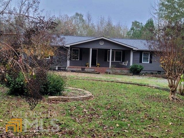 114 Quail Road Griffin, GA 30223 - Photo 1 of 1 a front view of a house with garden