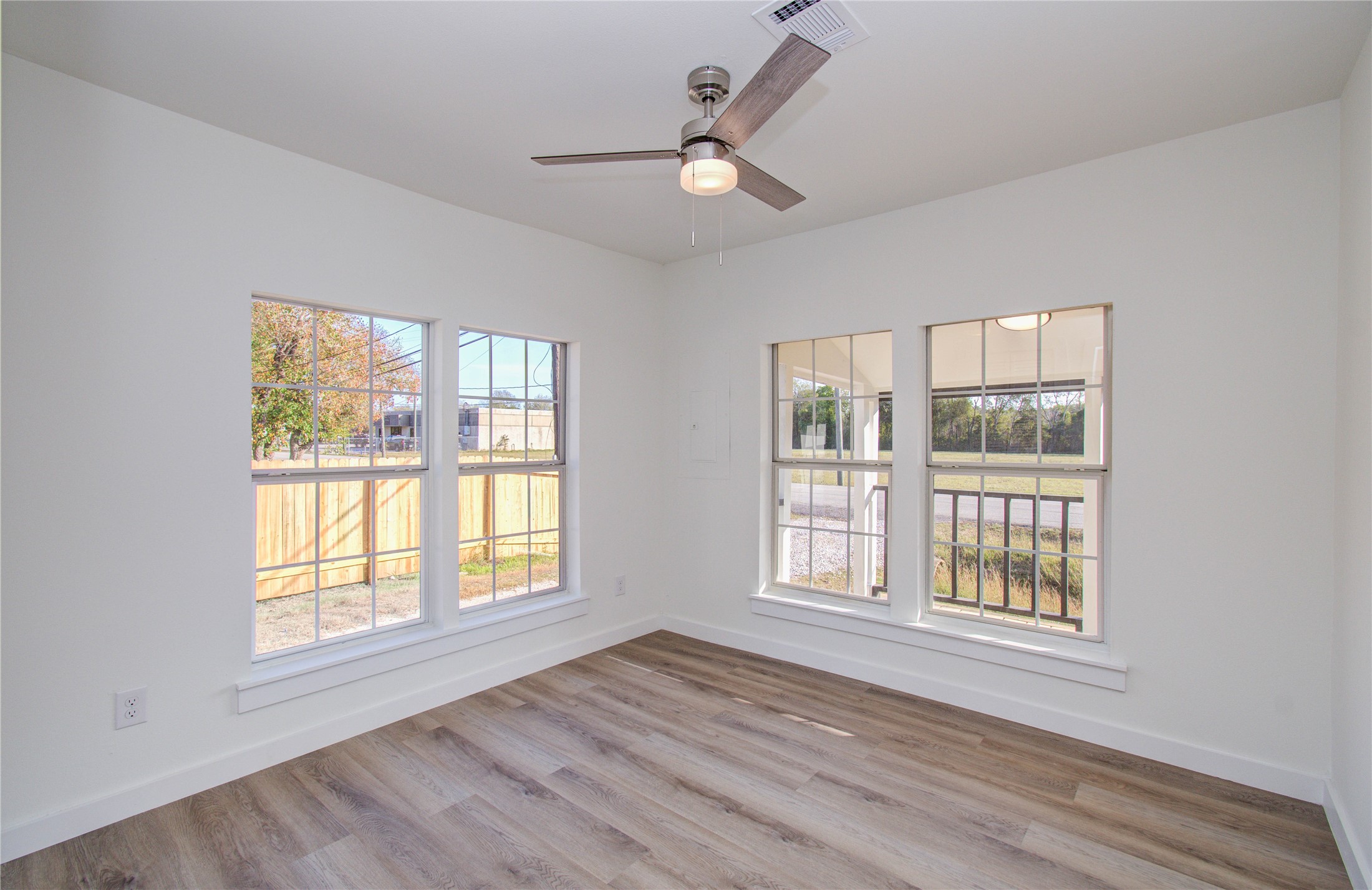 1301 Southgate Drive Rosenberg, TX 77471 - Photo 16 of 49 a view of an empty room with wooden floor and a window