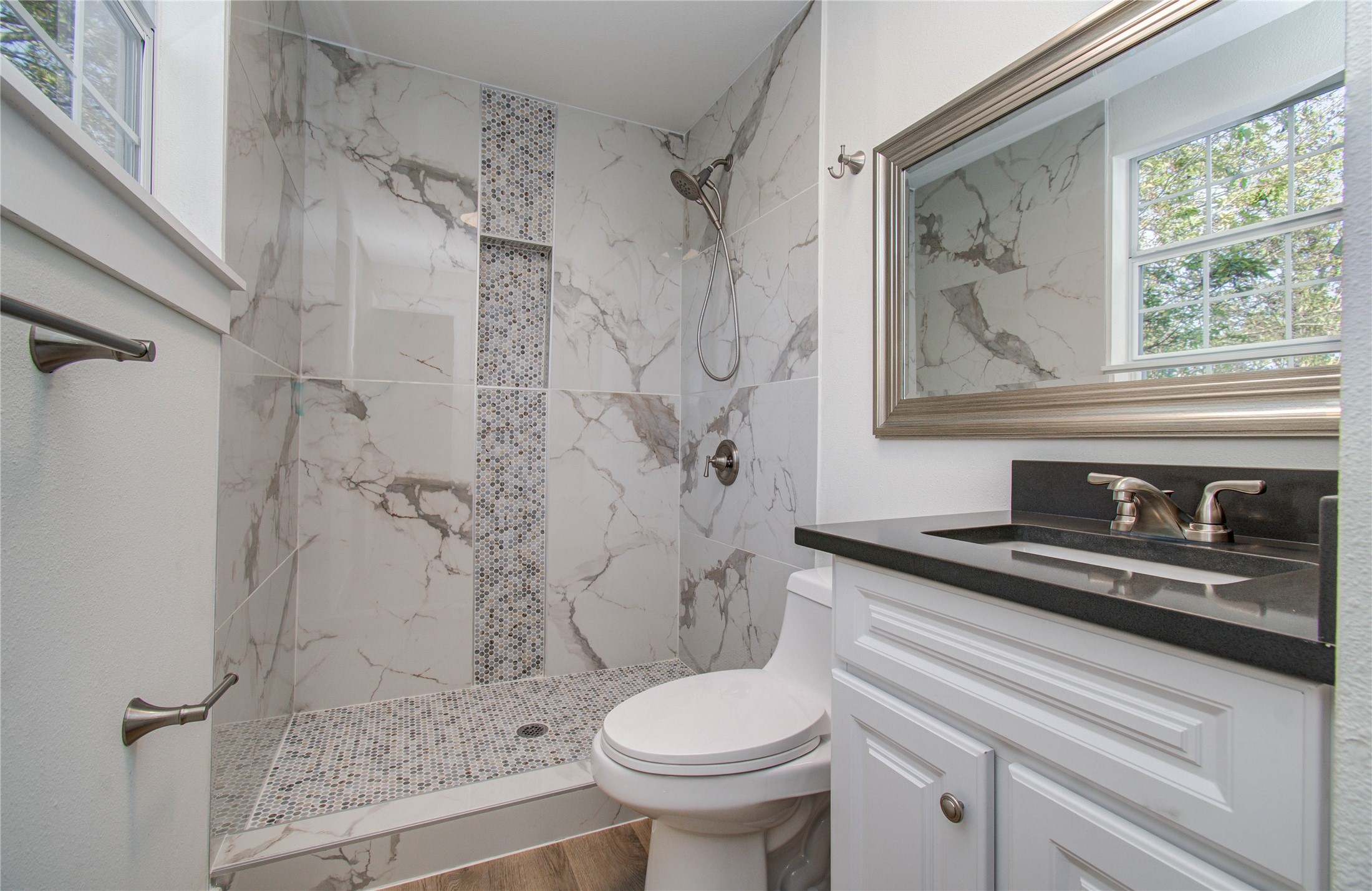 1301 Southgate Drive Rosenberg, TX 77471 - Photo 19 of 49 a bathroom with a sink toilet and shower