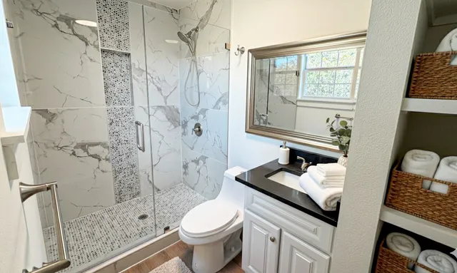 a bedroom with bed and a window