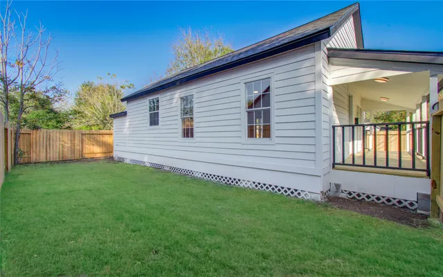 a large kitchen with kitchen island a sink dishwasher a stove and a refrigerator with wooden floor