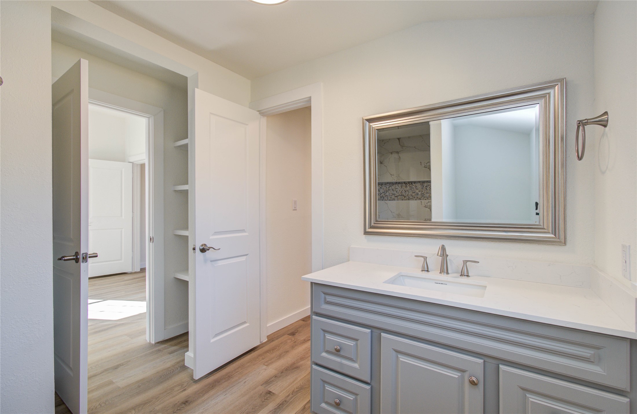 1301 Southgate Drive Rosenberg, TX 77471 - Photo 41 of 49 a bathroom with a sink a mirror and a shower
