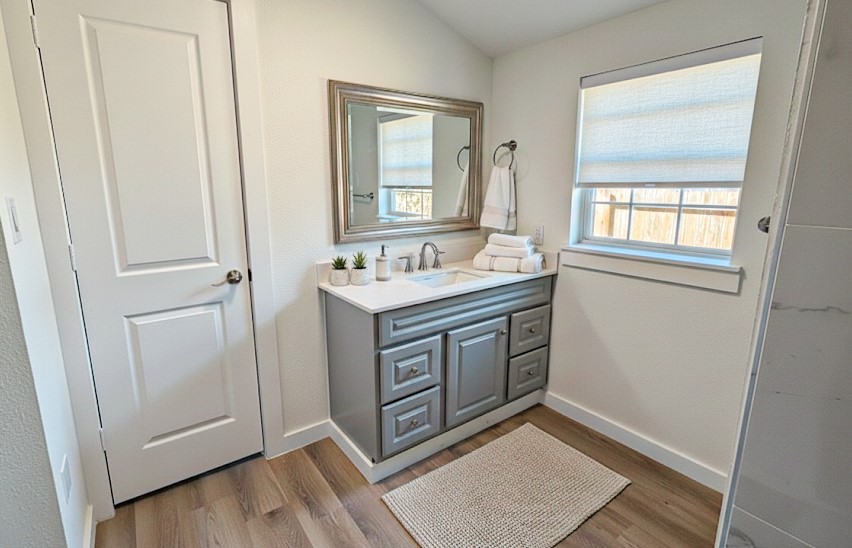 1301 Southgate Drive Rosenberg, TX 77471 - Photo 42 of 49 a bathroom with a sink a vanity and a mirror