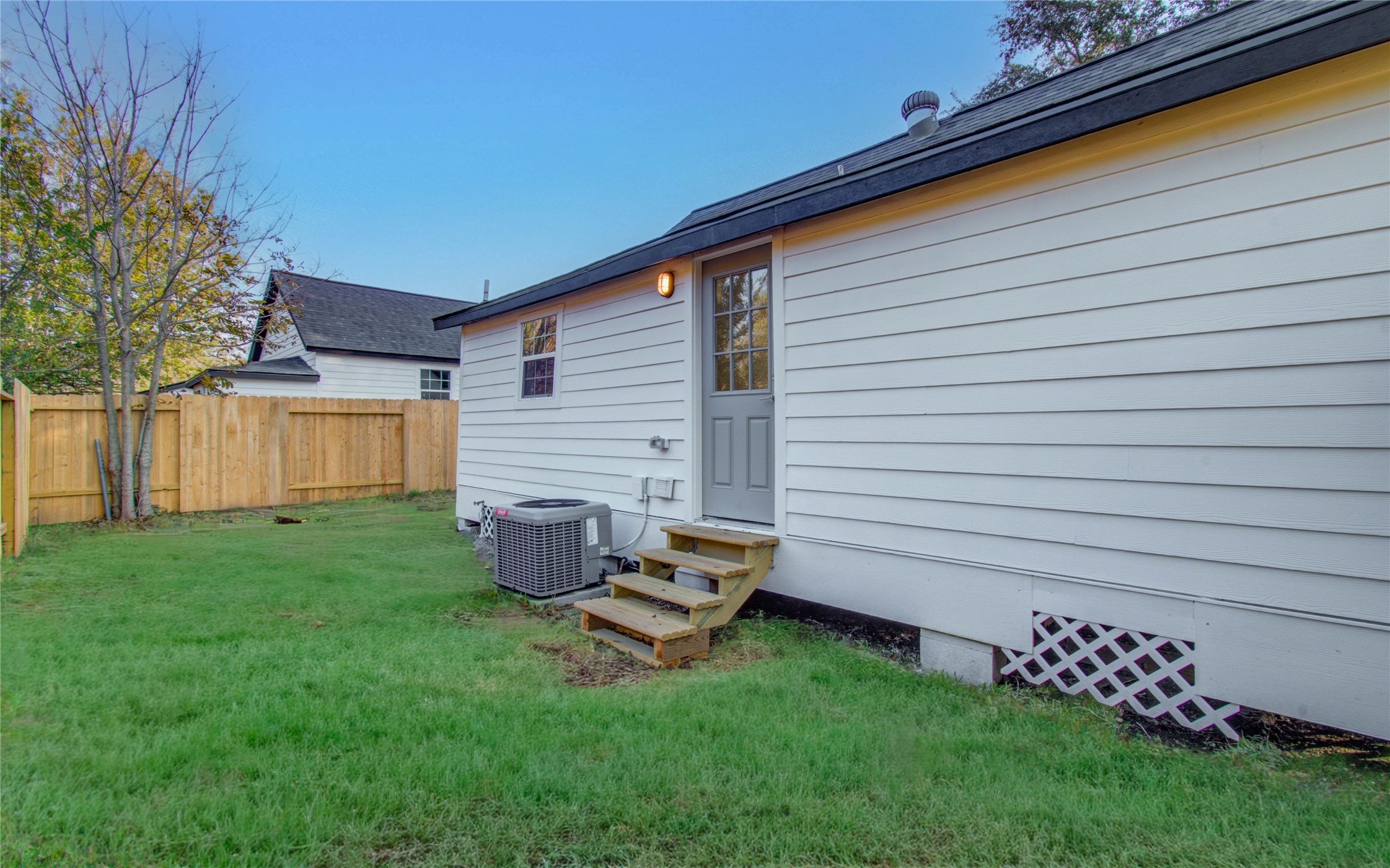 1301 Southgate Drive Rosenberg, TX 77471 - Photo 48 of 49 a backyard of a house with wooden table and chairs