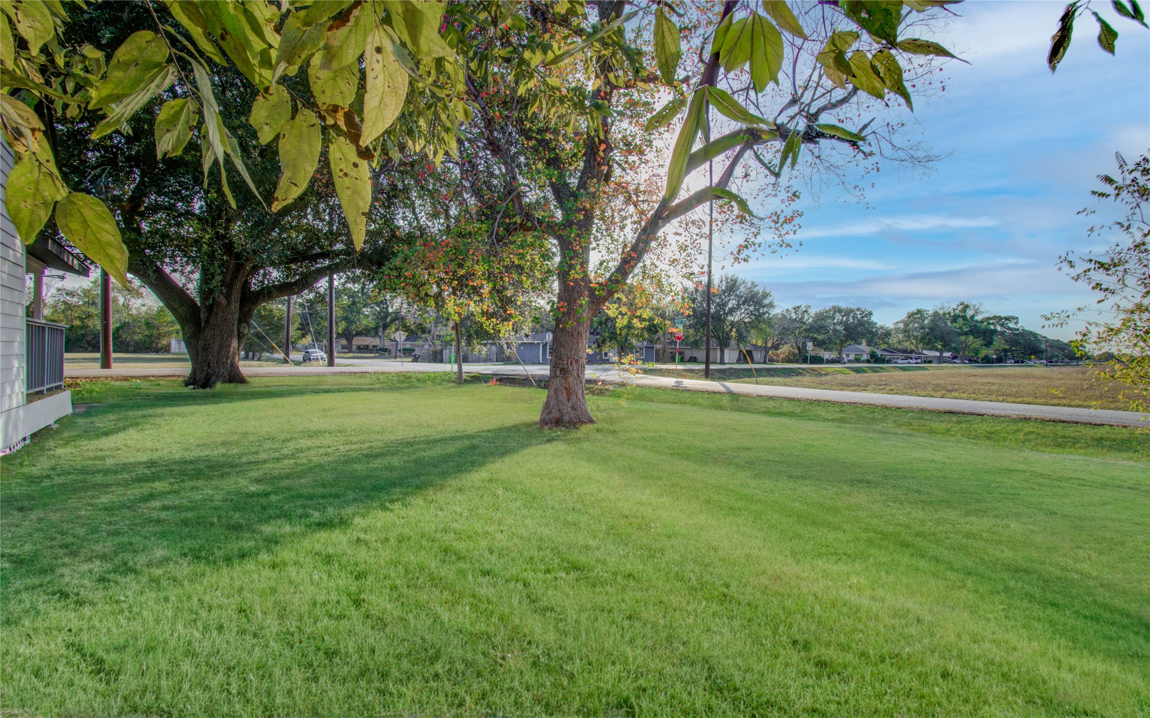 1301 Southgate Drive Rosenberg, TX 77471 - Photo 49 of 49 a view of grassy field with benches and trees all around