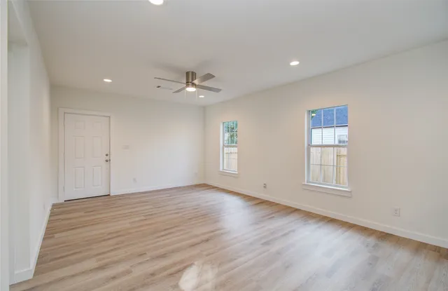 a view of an empty room with a window
