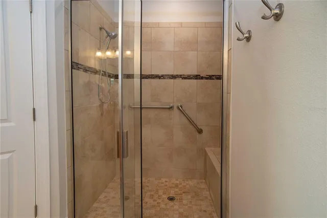 a living room with furniture a couch and a potted plant