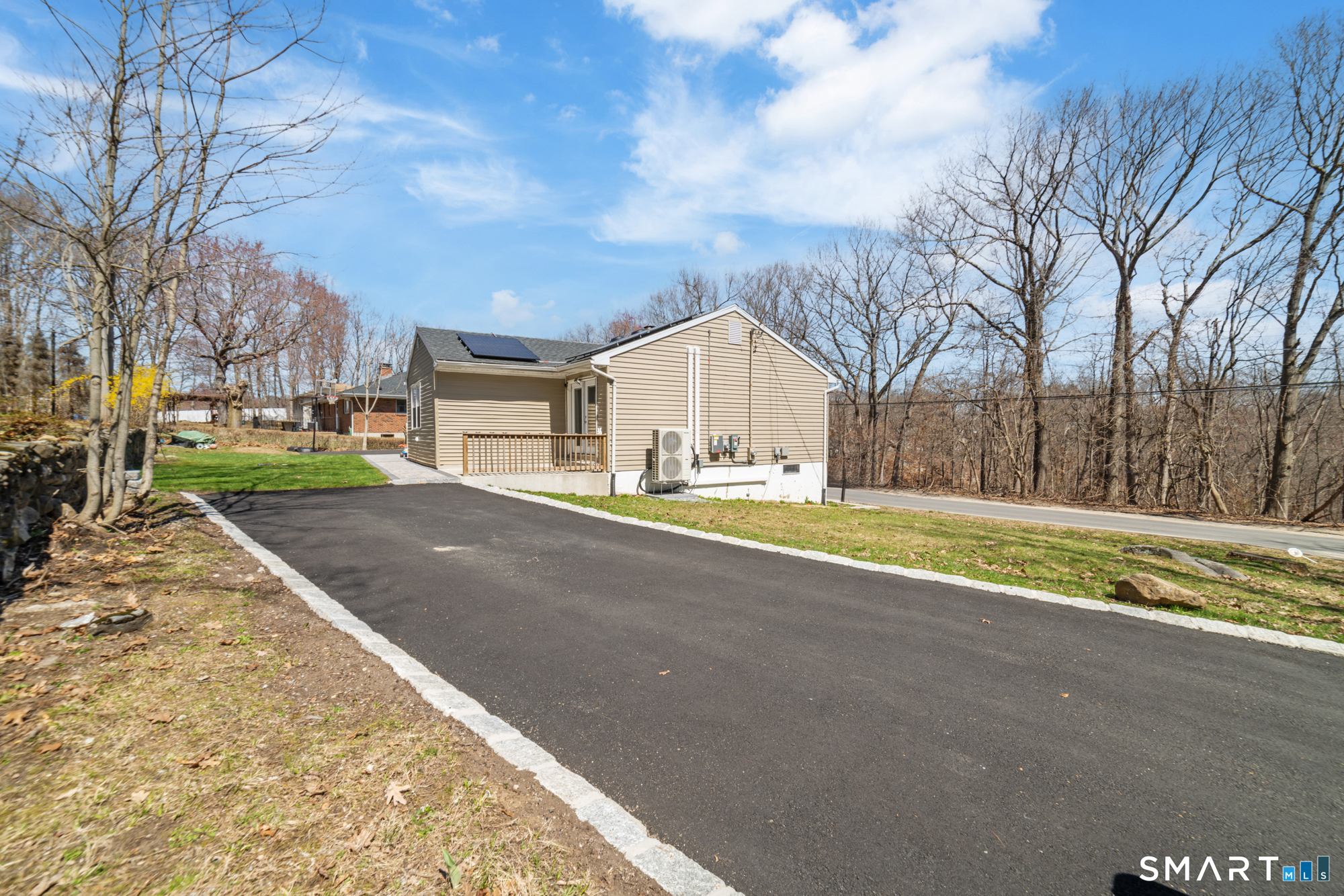 327 Lakeside Boulevard West Waterbury, CT 06708 - Photo 29 of 29 a view of house with yard and trees in the background