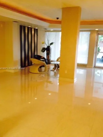 a view of a swimming pool with an outdoor space and seating area