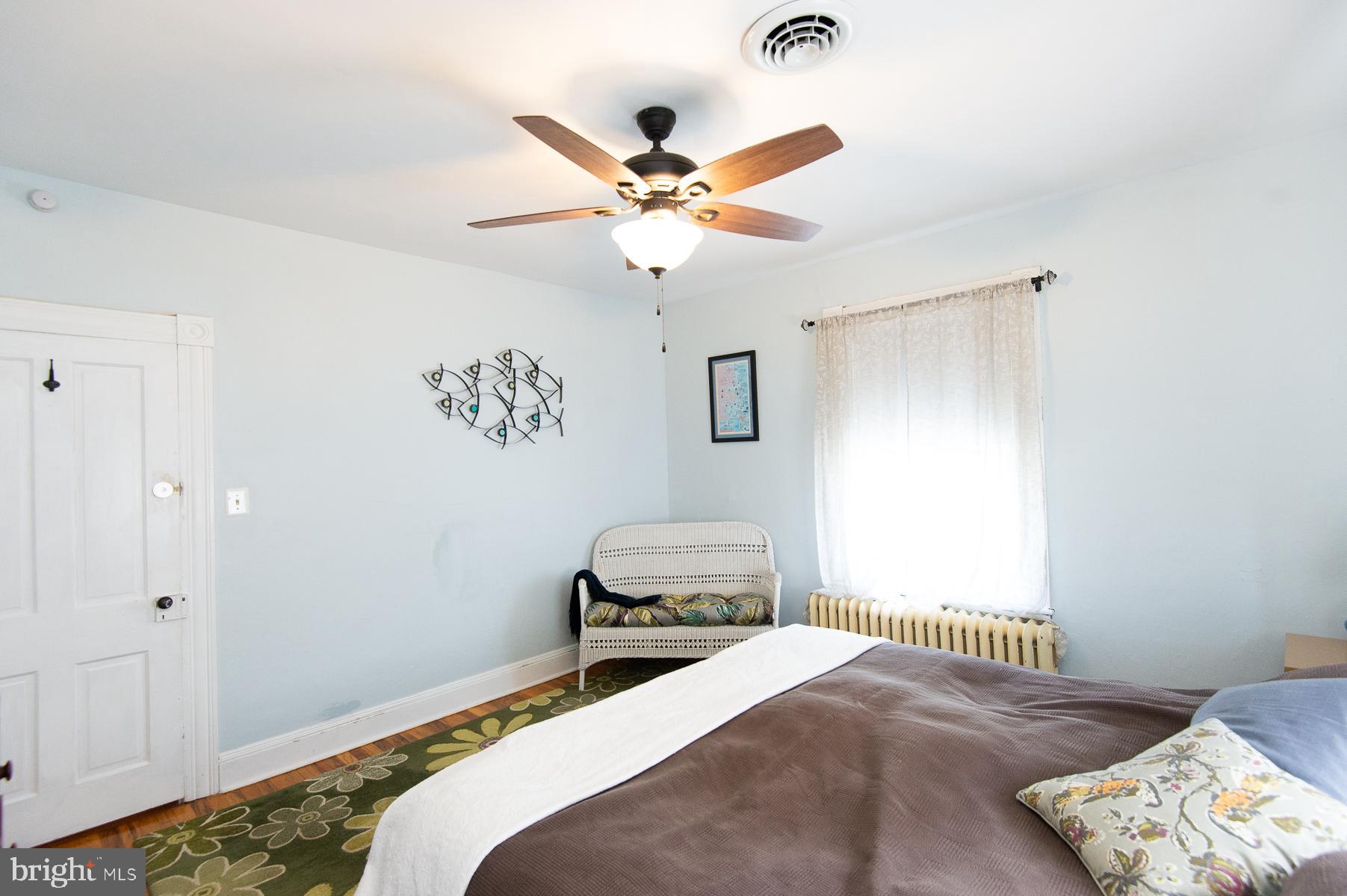 606 Locust Street Cambridge, MD 21613 - Photo 21 of 37 a bedroom with a bed and a window