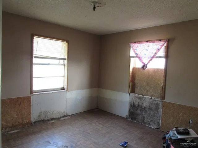 an empty room with windows