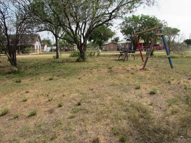 a view of outdoor space with deck and trees