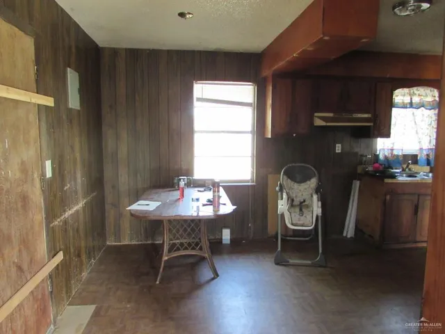 a dining room with furniture and window